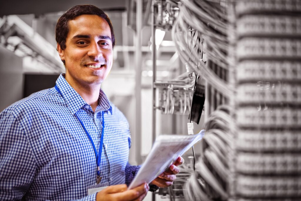 Portrait of technician analyzing server
