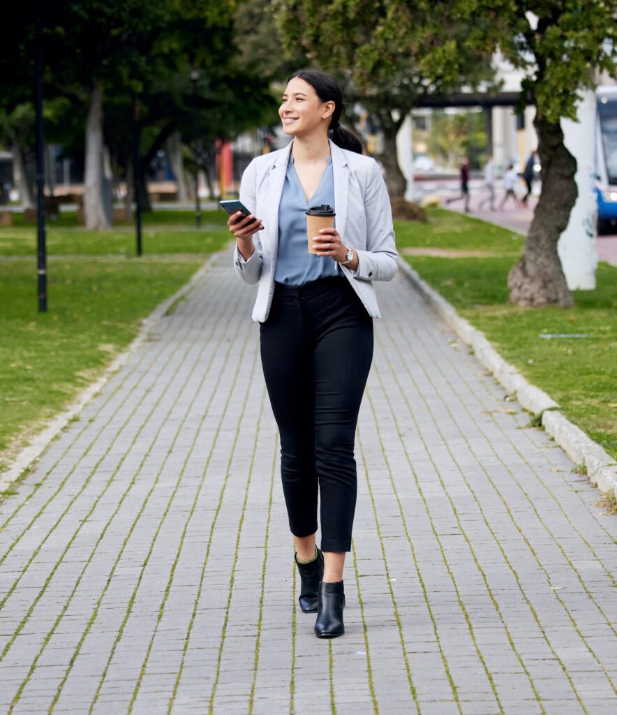 Shot of a young businesswoman making her way to wo