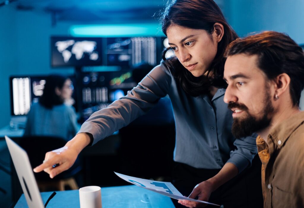 Stock trader team looking and analyzing stock data