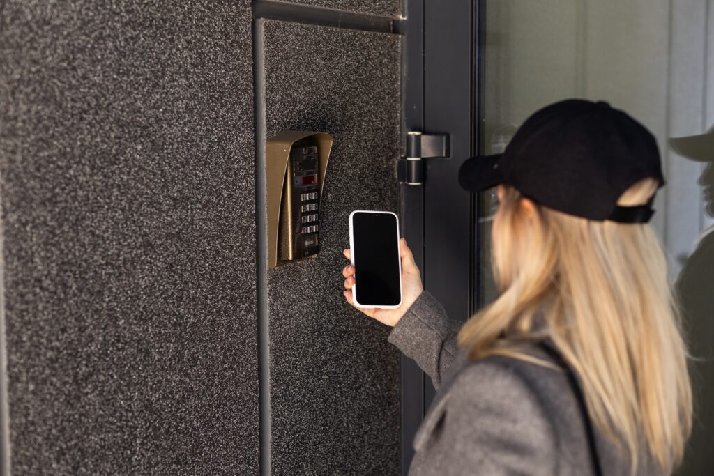 Woman open the safety door with smart phone