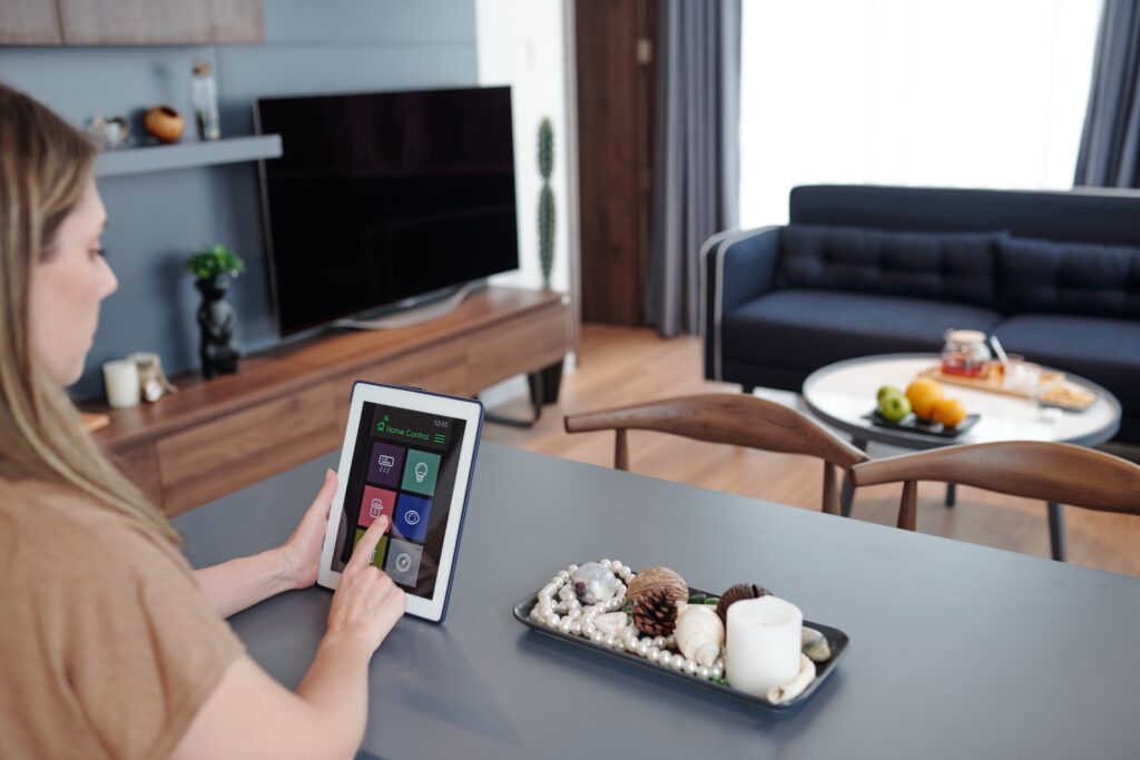 Woman using home control app
