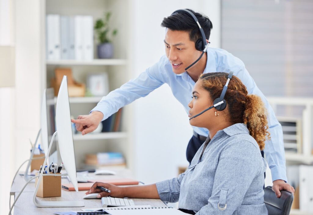 Young asian call centre telemarketing agent traini